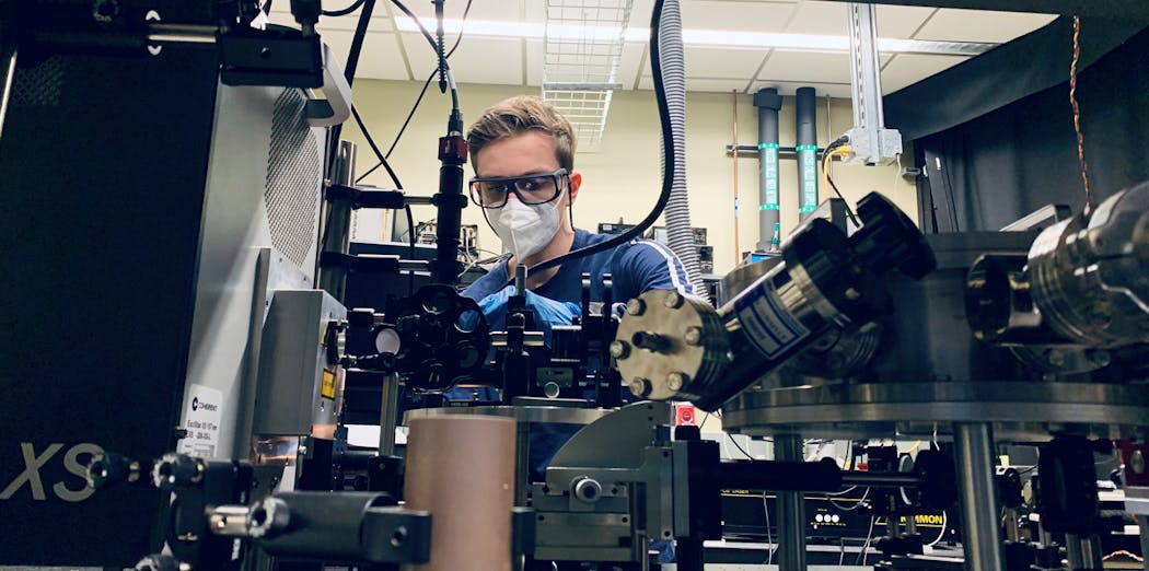 FIGURE 1. Researcher Len van Deurzen uses his team&rsquo;s optically pumped laser setup.