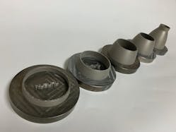 FIGURE 4. These 3D-printed scaled jet engine nozzles showcase the blue laser&rsquo;s ability to produce accurate detailed features, including the internal cooling channels.