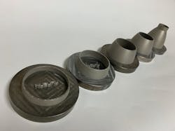 FIGURE 4. These 3D-printed scaled jet engine nozzles showcase the blue laser’s ability to produce accurate detailed features, including the internal cooling channels. FIGURE 4. These 3D-printed scaled jet engine nozzles showcase the blue laser’s ability to produce accurate detailed features, including the internal cooling channels.