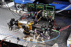 FIGURE 3. Laboratory-based two-photon frequency reference reaches relative instability of 10-13 at one second. FIGURE 3. Laboratory-based two-photon frequency reference reaches relative instability of 10-13 at one second.