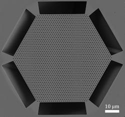FIGURE 4. Top view of a scanning electron micrograph of the BerkSEL. Its hexagonal lattice photonic crystal forms an electromagnetic cavity.