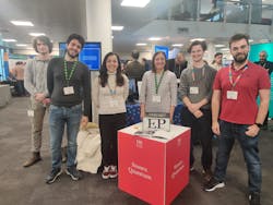 The Emergent Photonics group presenting the microcomb during the quantum showcase, from left to right: Vittorio Cecconi, Antonio Cutronia, Luana Olivieri, Alessia Pasquazi, Maxwell Rowley, and Luke Peters. The Emergent Photonics group presenting the microcomb during the quantum showcase, from left to right: Vittorio Cecconi, Antonio Cutronia, Luana Olivieri, Alessia Pasquazi, Maxwell Rowley, and Luke Peters.