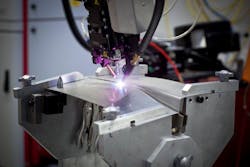 FIGURE 2. A test set-up for a deck lid application using a fiber coupled diode laser with a tactile process head is shown. FIGURE 2. A test set-up for a deck lid application using a fiber coupled diode laser with a tactile process head is shown.