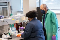 FIGURE 2. Researchers Alexis Weber (left) and Igor Lednev prepare samples for their work analyzing biological stains and fluids. FIGURE 2. Researchers Alexis Weber (left) and Igor Lednev prepare samples for their work analyzing biological stains and fluids.