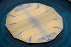FIGURE 3. Photograph of the upcoming 52-mode quantum photonic processor of QuiX Quantum. The system contains 2652 tunable elements enabling reconfiguration and programming of the processor. FIGURE 3. Photograph of the upcoming 52-mode quantum photonic processor of QuiX Quantum. The system contains 2652 tunable elements enabling reconfiguration and programming of the processor.
