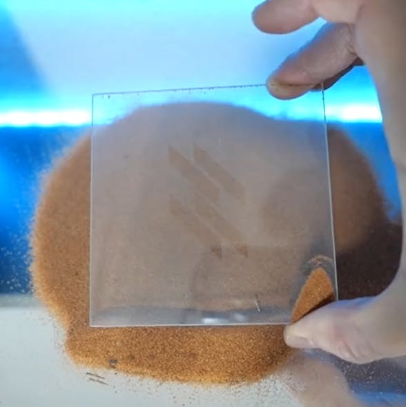 FIGURE 3. Application tests with sand from Kalahari on Fusion Bionic&rsquo;s anti-soiling surface.