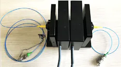 A dual-stage rotation stage coupled to optical fibers at the input and output ports