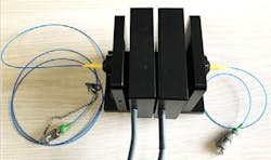 A dual-stage rotation stage coupled to optical fibers at the input and output ports A dual-stage rotation stage coupled to optical fibers at the input and output ports