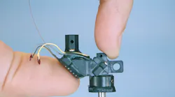 FIGURE 1. A 3-g MINI2P miniaturized head-mounted two-photon microscope.