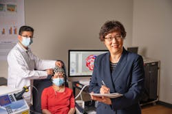 A team led by researcher Dr. Hanli Liu (right) is currently developing a dual-mode brain sensing device that pairs near-IR spectroscopy with EEG for quicker, more accurate detection of Alzheimer&rsquo;s disease.