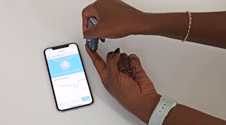 The new handheld, smartphone-operated near-infrared spectrometer shines infrared light on a person&rsquo;s skin to detect the presence of malaria.