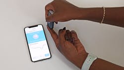 The new handheld, smartphone-operated near-infrared spectrometer shines infrared light on a person’s skin to detect the presence of malaria. The new handheld, smartphone-operated near-infrared spectrometer shines infrared light on a person’s skin to detect the presence of malaria.