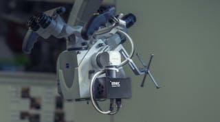 FIGURE 1. Thanks to a small form factor and compatibility with standard C-mount optics, imec&rsquo;s snapscan can easily be mounted on a standard surgical microscope.