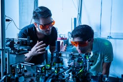 FIGURE 1. Kamyar Parto (left) works in the Moody Quantum Photonics Lab with Arjun Choudhri, a high school student he mentored last summer. FIGURE 1. Kamyar Parto (left) works in the Moody Quantum Photonics Lab with Arjun Choudhri, a high school student he mentored last summer.