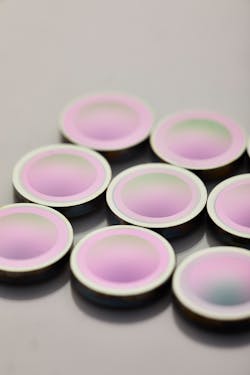 Examples of the company's infrared (IR) optics are shown. Examples of the company's infrared (IR) optics are shown.