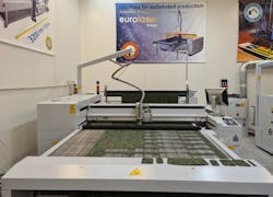 FIGURE 2. Laser processing of Cordura for a prototype production of military uniforms. FIGURE 2. Laser processing of Cordura for a prototype production of military uniforms.