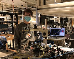 FIGURE 2. Mateus Corato-Zanarella in the lab coupling light from a blue laser diode to a photonic chip. FIGURE 2. Mateus Corato-Zanarella in the lab coupling light from a blue laser diode to a photonic chip.