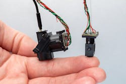 Salk researchers developed two wearable microscopes to image cellular activity in previously inaccessible regions of the spinal cord of moving mice in real time. Salk researchers developed two wearable microscopes to image cellular activity in previously inaccessible regions of the spinal cord of moving mice in real time.