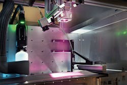 Using custom optics, the laser radiates a larger area on the copper foil coated with graphite paste. The interaction between the graphite particles and the light energy generates heat and the liquid evaporates. Using custom optics, the laser radiates a larger area on the copper foil coated with graphite paste. The interaction between the graphite particles and the light energy generates heat and the liquid evaporates.