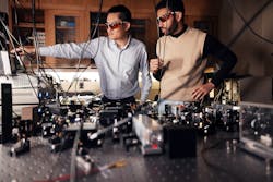 FIGURE 1. Zheshen Zhang and his student Kareem Hariri working on an entangled light source. FIGURE 1. Zheshen Zhang and his student Kareem Hariri working on an entangled light source.