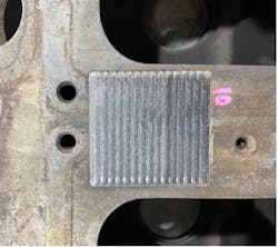 FIGURE 3. A Caterpillar diesel engine block produced using diode laser cladding with 316L powder at PTT. FIGURE 3. A Caterpillar diesel engine block produced using diode laser cladding with 316L powder at PTT.