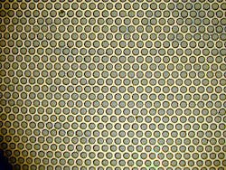 FIGURE 1. Excimer lasers can be used with a photomask pattern to efficiently perform repetitive tasks, such as parallel processing of multiple holes. FIGURE 1. Excimer lasers can be used with a photomask pattern to efficiently perform repetitive tasks, such as parallel processing of multiple holes.