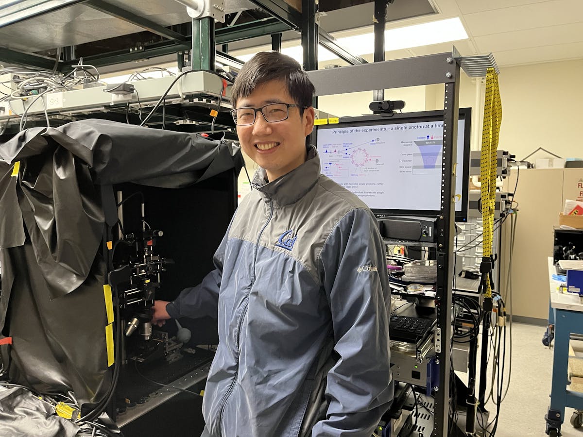 FIGURE 2. Quanwei Li in the lab, with the team&rsquo;s quantum light spectroscopy setup.