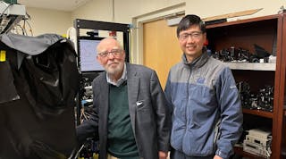Scientists Graham Fleming (left) and Quanwei Li in the lab with their quantum light spectroscopy setup.