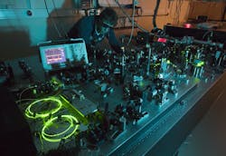 FIGURE 1. The group’s first Er:fiber laser system, designed for two-color femtosecond experiments on single-electron systems. FIGURE 1. The group’s first Er:fiber laser system, designed for two-color femtosecond experiments on single-electron systems.