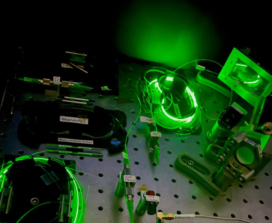 FIGURE 2. Ultrastable and compact two-branch Er:fiber laser system for applications in time-domain quantum physics.