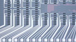 FIGURE 1. Microscope image of a photonic chip hosting the programmable processor used for the photonic neural network.