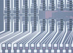 FIGURE 1. Microscope image of a photonic chip hosting the programmable processor used for the photonic neural network. FIGURE 1. Microscope image of a photonic chip hosting the programmable processor used for the photonic neural network.