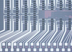 FIGURE 1. Microscope image of a photonic chip hosting the programmable processor used for the photonic neural network. FIGURE 1. Microscope image of a photonic chip hosting the programmable processor used for the photonic neural network.