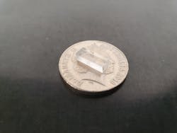 FIGURE 2. This optical glass chip, created at Macquarie University, feeds data into an ultra-high-speed, multicore optical fiber. FIGURE 2. This optical glass chip, created at Macquarie University, feeds data into an ultra-high-speed, multicore optical fiber.