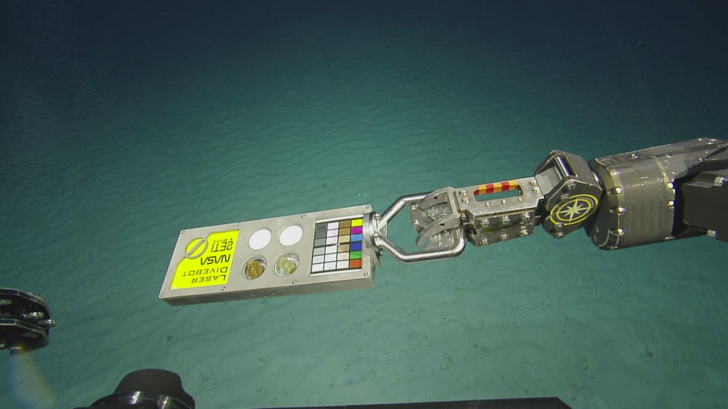 FIGURE 3. InVADER&rsquo;s laser analyzing the mineral composition of a rock found on the ocean floor.