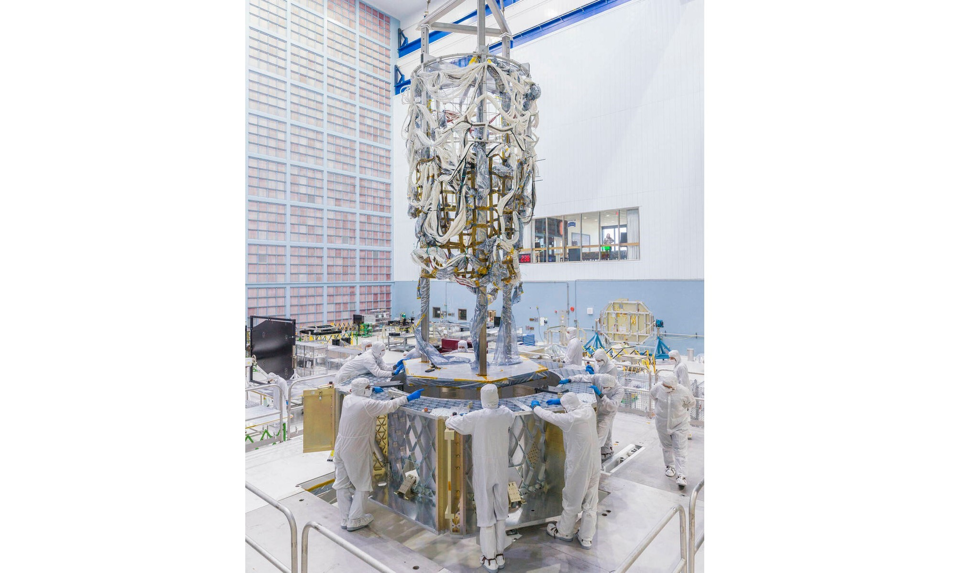 FIGURE 1. The Nancy Grace Roman Space Telescope&rsquo;s flight harness gets transferred from its mock-up structure to the spacecraft flight structure.
