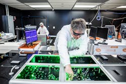 Bjorn “Manuel” Hegelich working on TAU Systems’ laser-driven particle accelerator. Bjorn “Manuel” Hegelich working on TAU Systems’ laser-driven particle accelerator.