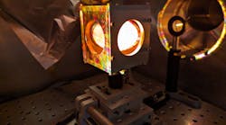 White light from a laser-generated air plasma is incident on the pointing screen of the TAU Systems electron spectrometer. White light from a laser-generated air plasma is incident on the pointing screen of the TAU Systems electron spectrometer.