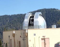 FIGURE 3. A high-power NIR laser transmitter at NASA Jet Propulsion Laboratory’s Table Mountain facility will transmit low-rate data to the transceiver in space. FIGURE 3. A high-power NIR laser transmitter at NASA Jet Propulsion Laboratory’s Table Mountain facility will transmit low-rate data to the transceiver in space.