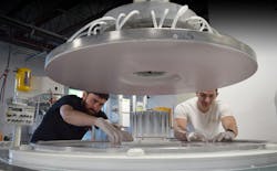Ryan Hegarty (left) and Stephen Long (right) inspect a run of windows on a double-sided polisher. Ryan Hegarty (left) and Stephen Long (right) inspect a run of windows on a double-sided polisher.