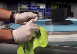 A fused silica window being cleaned with an E-Cloth glass and polishing cloth. A fused silica window being cleaned with an E-Cloth glass and polishing cloth.