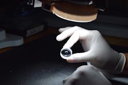 Quality control inspection of window with polished dimple in the center. Quality control inspection of window with polished dimple in the center.