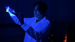 Jee Yung Park looks at some of the perovskite crystals in the lab.