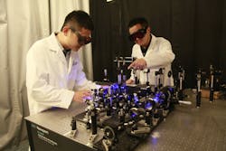 INRS researchers Xianglei Liu (left) and Jinyang Liang (right), working on the DRUM camera system. INRS researchers Xianglei Liu (left) and Jinyang Liang (right), working on the DRUM camera system.