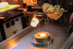 Making specialty glass in the laboratory by quickly cooling the glass melt on a cold metal slate (melt-quenching). Making specialty glass in the laboratory by quickly cooling the glass melt on a cold metal slate (melt-quenching).