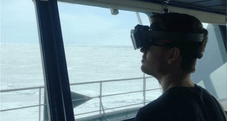 FIGURE 5. Researcher Jon Fauske experiments with AR navigation using the HoloLens 2 with sun screen during bright light conditions in the Arctic.
