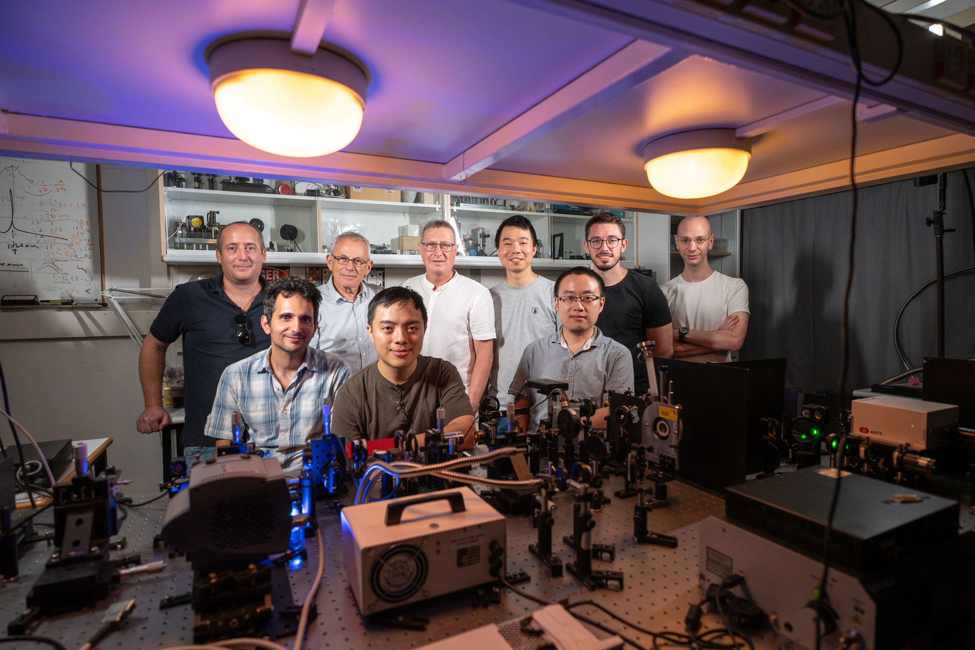 FIGURE 1. Group in the lab: Prof. Elad Koren, Dr. Assael Cohen, Dr. Vladimir Kleiner, Chieh-li Liu, Prof. Erez Hasman, Dr. Kexiu Rong, Dr. Xiaoyang Duan, Vladi Gorovoy, and Dror Reichenberg.