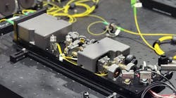 QU-SOURCE leverages a spontaneous four-wave mixing (SFWM) within an atomic vapor (rubidium) to produce highly pure polarization-entangled photon pairs. QU-SOURCE leverages a spontaneous four-wave mixing (SFWM) within an atomic vapor (rubidium) to produce highly pure polarization-entangled photon pairs.