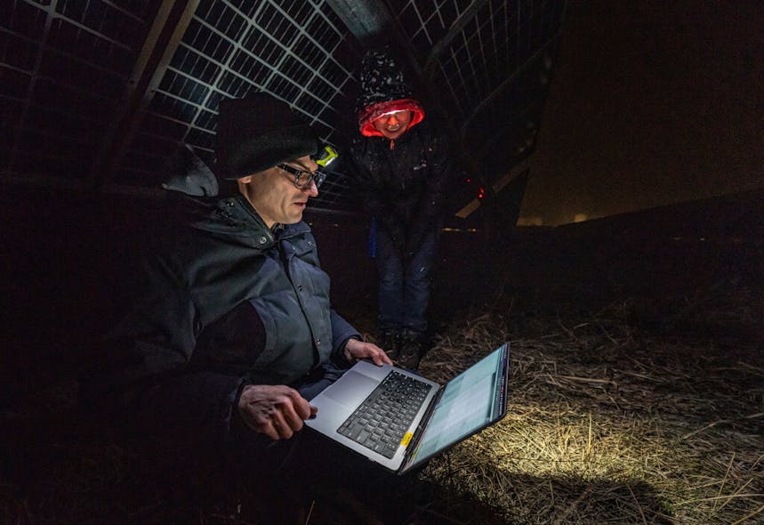 National Renewable Energy Laboratory (NREL) researchers Tim Silverman and Nicole Luna look over data generated by PLatypus, which was connected to a photovoltaics system on the Flatirons campus.