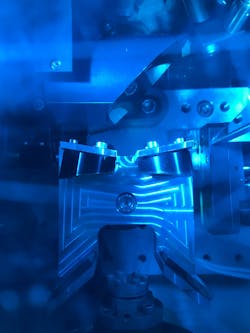 A top-down view peering in through the window on top of the vacuum chamber in which the sample is housed. Inside you can see the optics for sending both the pump beam and the probe beam onto the sample, as well as sending the reflected probe beam to the detector. A top-down view peering in through the window on top of the vacuum chamber in which the sample is housed. Inside you can see the optics for sending both the pump beam and the probe beam onto the sample, as well as sending the reflected probe beam to the detector.